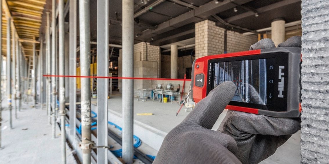 User taps PD-C_PD-CS screen with work gloves to capture a horizontal measurement with outdoor bright light while using camera target feature