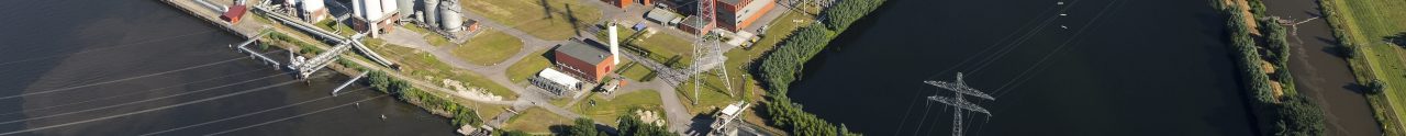 19 July 2016, Geertruidenberg, Holland. Aerial view of the AMERCENTRALE, a coal and biomass fired Essent powerplant. It's located at the river Amer. In the back the town of GEERTRUIDENBERG. 